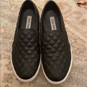 Steve Madden black quilted slip ons